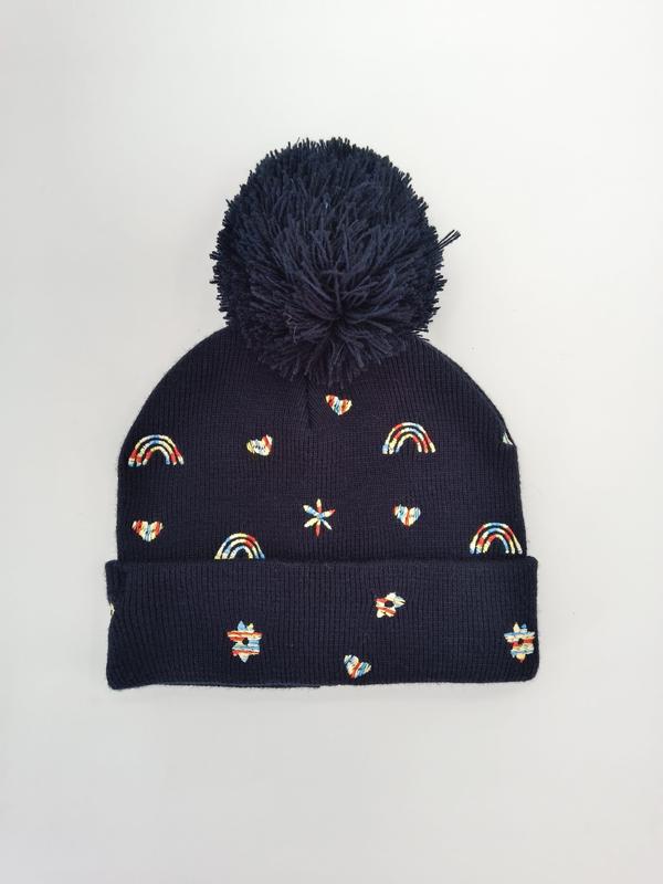 Navy blue ribbed knit bobble hat with large pom-pom and colorful embroidered rainbow, heart, and star motifs - certified scarf manufacturer China - custom Pantone color matching