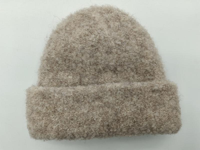 Oatmeal beige boucle knit cuffed beanie hat with fluffy textured yarn, laid flat on white background - air shipping 5-7 days arrival