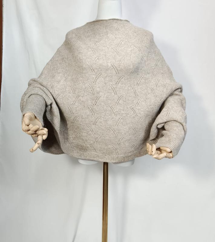 Oversized oatmeal beige pointelle knit sweater with balloon sleeves displayed on a mannequin with wooden artist hands - jacquard custom pattern accepted