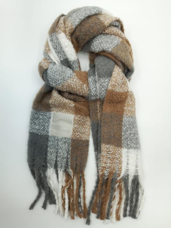 Cozy oversized plaid scarf in grey, camel brown, and white with fringe ends, loosely looped on white background - jacquard custom pattern accepted