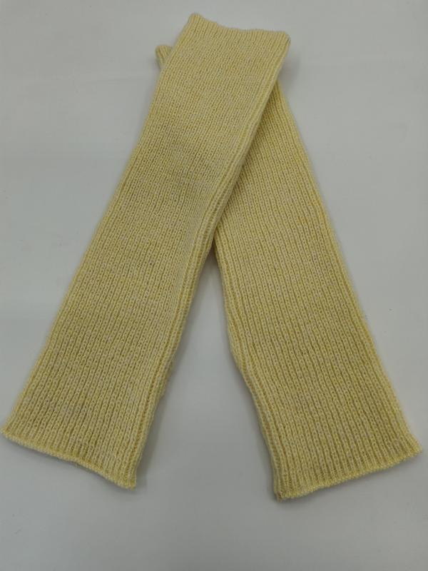Pair of pale yellow ribbed knit fingerless arm warmers laid flat crossed on white background - no MOQ for stock designs