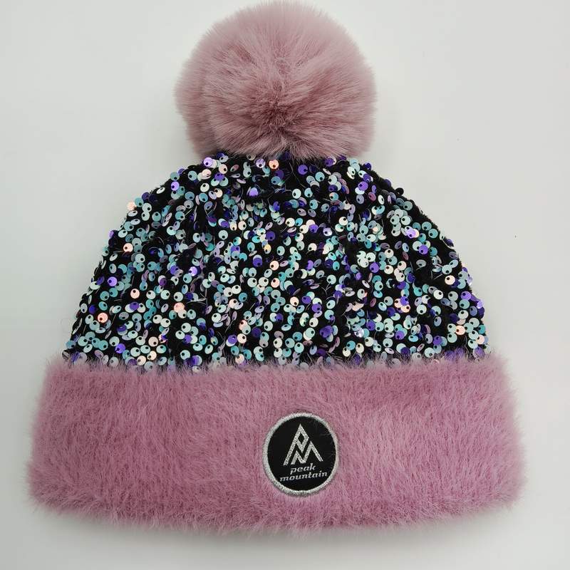 Pink winter beanie hat with iridescent sequin body, fluffy faux fur pink cuff and oversized pom-pom on white background - retail buyer inquiry welcome - low MOQ 50pcs trial order