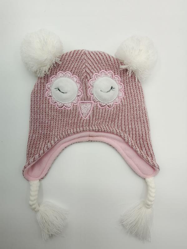 Pink chunky knit children's winter hat with owl face embroidery, white pom poms, ear flaps, and braided tassels - WhatsApp quote in 2 hours