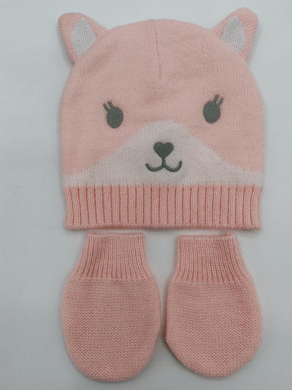 Pink knitted baby beanie hat with bear ears and face design paired with matching mittens set on white background - BSCI audit passed supplier