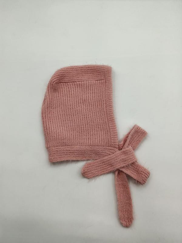 Soft pink ribbed knit baby bonnet with long tie strings laid flat on white background - retail buyer inquiry welcome - small batch 100pcs accepted