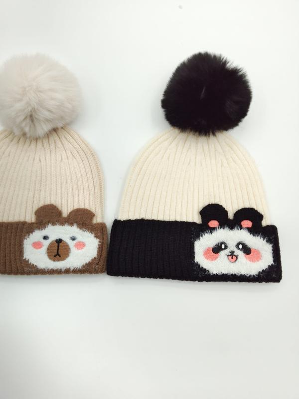 Two ribbed knit pom-pom beanies with bear and panda appliqué patches, beige with cream pom and white with black pom - free sample within 7 days