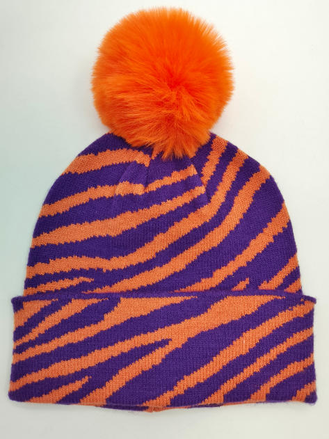 Knit beanie hat with purple and orange zebra stripe pattern and large orange faux fur pompom on top - ISO 9001 quality controlled