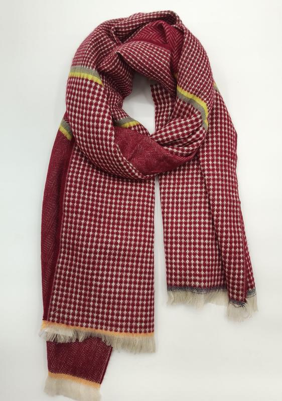 Red and ivory diamond houndstooth patterned woven scarf with yellow stripe accents and fringe ends, loosely looped - request quote reply same day