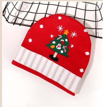 Red knitted winter beanie hat featuring embroidered Christmas tree, snowflakes, and striped cuff band on white background - no MOQ for stock designs