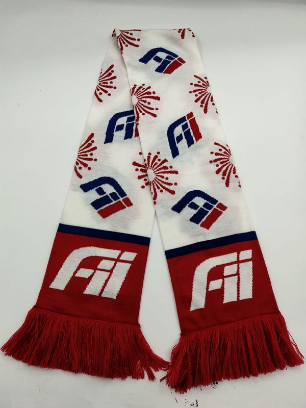 Knitted fan scarf in red, white and blue with repeated logo and firework motifs, red fringe ends laid flat on white background - MOQ 100pcs mixed colors OK