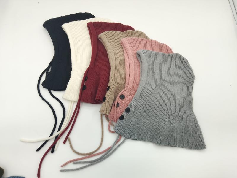 Six ribbed knit balaclava hoods in navy, cream, burgundy, beige, pink, and gray with button closures and tie strings - event merchandise supplier