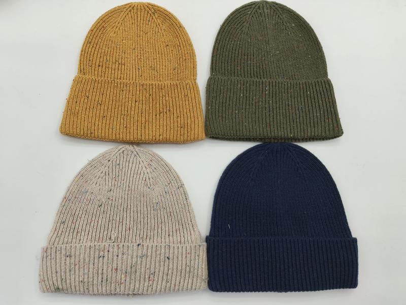 Four ribbed knit beanies in mustard yellow, olive green, oatmeal fleck, and navy blue laid flat on white background - MOQ 100pcs mixed colors OK