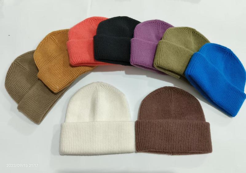 Collection of 10 ribbed knit cuffed beanie hats in assorted colors including white, black, red, blue, purple, olive, brown, and camel on white background - air shipping 5-7 days arrival