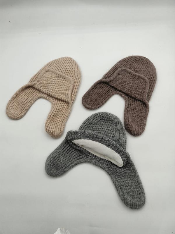 Three ribbed knit earflap beanies in beige, brown, and gray laid flat on white background - low MOQ 50pcs trial order