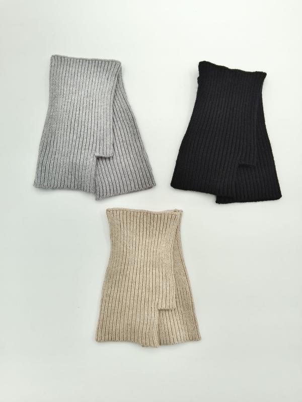 Three ribbed knit fingerless gloves laid flat in grey, black, and beige colorways on a white background - winter accessories wholesaler