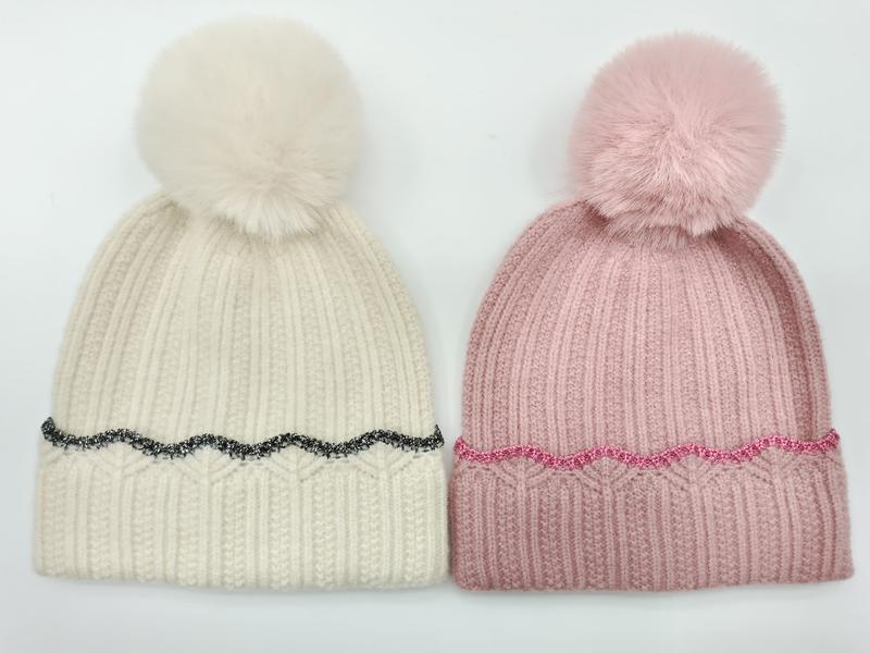 Two ribbed knit pom pom beanies side by side, cream with black glitter trim and pink with pink glitter trim, faux fur pompoms - WhatsApp quote in 2 hours