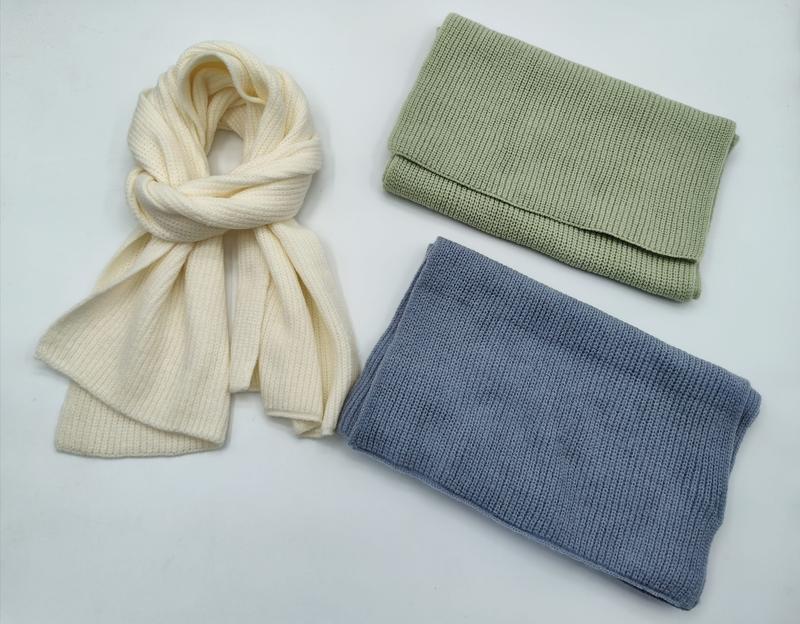Three ribbed knit winter accessories on white background: cream scarf loosely tied, folded sage green and steel blue neck warmers - ODM OEM service available - low MOQ 50pcs trial order