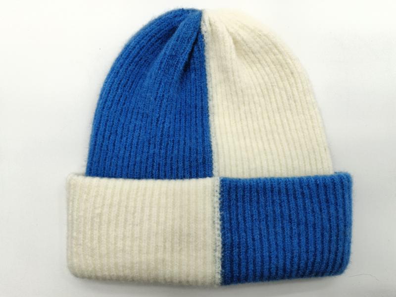 Color-block ribbed knit beanie hat in royal blue and off-white with folded cuff, laid flat on white background - custom packaging design free