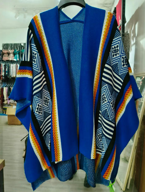 Royal blue open-front knit kimono cardigan with Aztec geometric diamond pattern in white, black, and orange stripes on hanger - bulk order 20-day delivery
