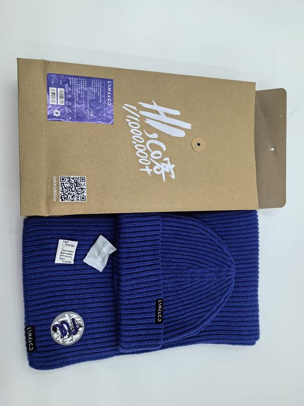 Royal blue ribbed knit beanie hat and matching scarf set with logo patch, displayed with kraft paper gift box packaging - private label service available