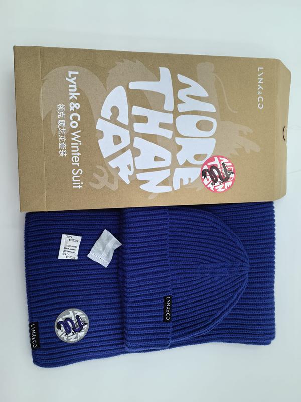 Royal blue ribbed knit beanie hat and matching scarf winter set laid flat beside kraft gift box packaging - custom logo label accepted