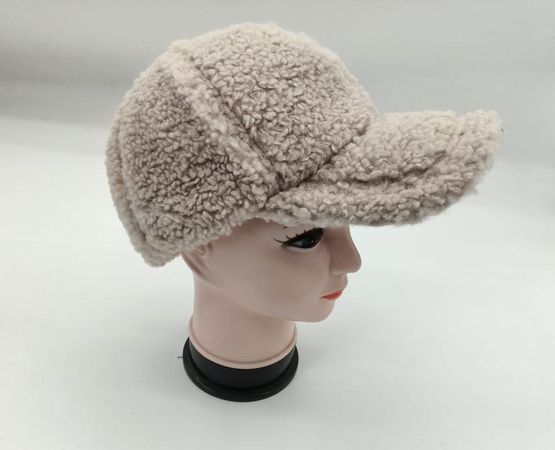 Cream beige sherpa fleece baseball cap with structured brim displayed on a mannequin head, side view - wholesale price for Middle East buyers