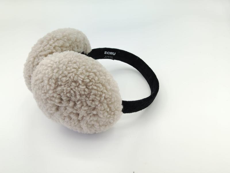 Cream beige sherpa fleece earmuffs with black velvet headband displayed on white background, showing fluffy textured ear cushions - custom logo label accepted