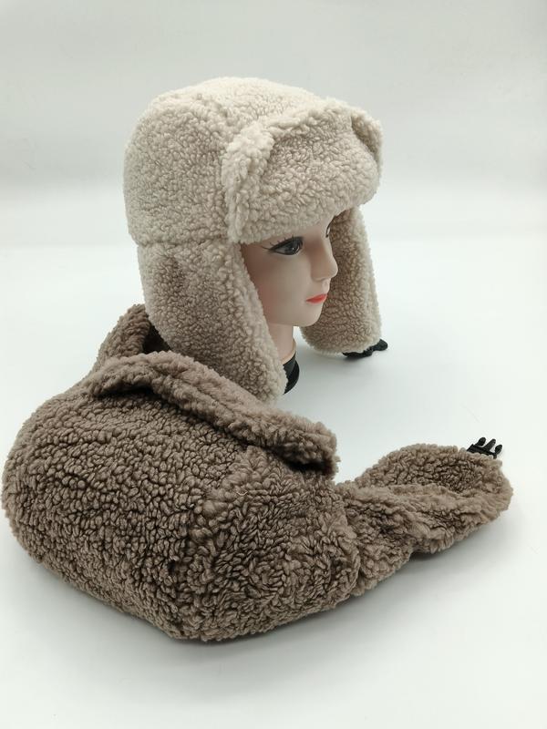 Cream and taupe sherpa fleece trapper ushanka hat with ear flaps displayed on mannequin head with matching hat below - certified scarf manufacturer China - express production 15 days