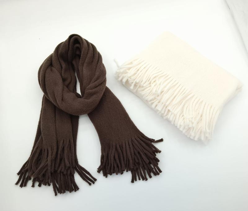 Brown twisted fringed scarf and folded cream fringed shawl wrap displayed on white background - corporate gift customization