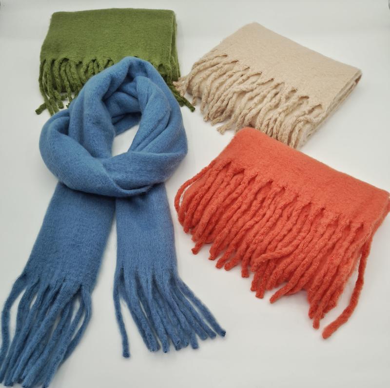 Four fringed wool blend scarves in blue, olive green, beige, and coral orange displayed on white background - wholesale price for Middle East buyers