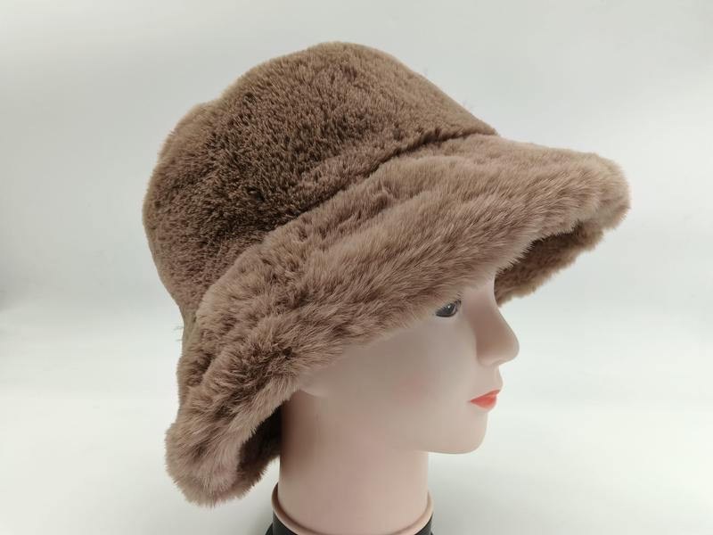 Taupe brown faux fur bucket hat displayed on a mannequin head, side view, soft fluffy plush winter hat - no MOQ for stock designs