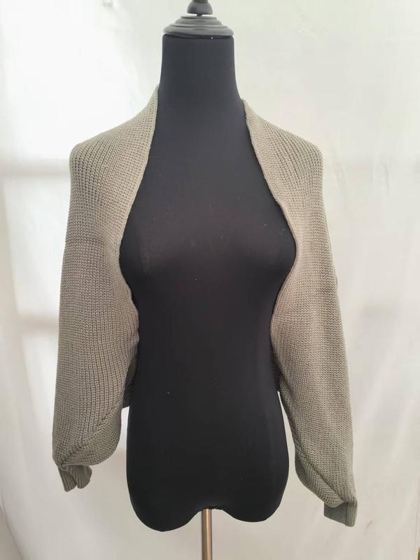 Taupe chunky knit cropped shrug cardigan with long sleeves displayed on a black dress form mannequin - event merchandise supplier