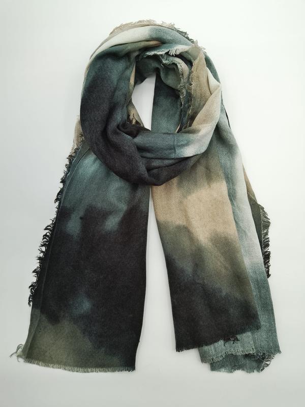 Folded large tie-dye scarf in dark green, charcoal, and taupe ombre pattern with fringe edges on white background - request quote reply same day