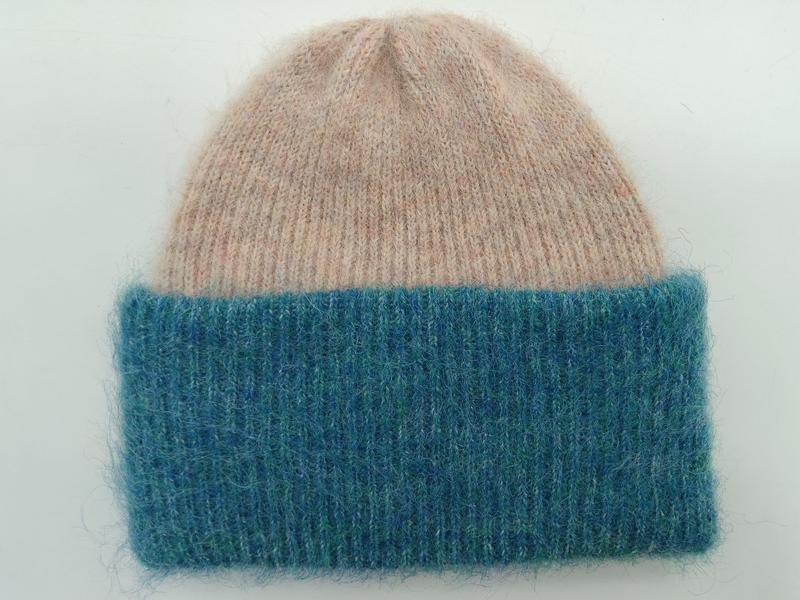 Soft fuzzy knit beanie hat with blush pink crown and wide teal ribbed cuff, flat lay on white background - tiered pricing available ask quote