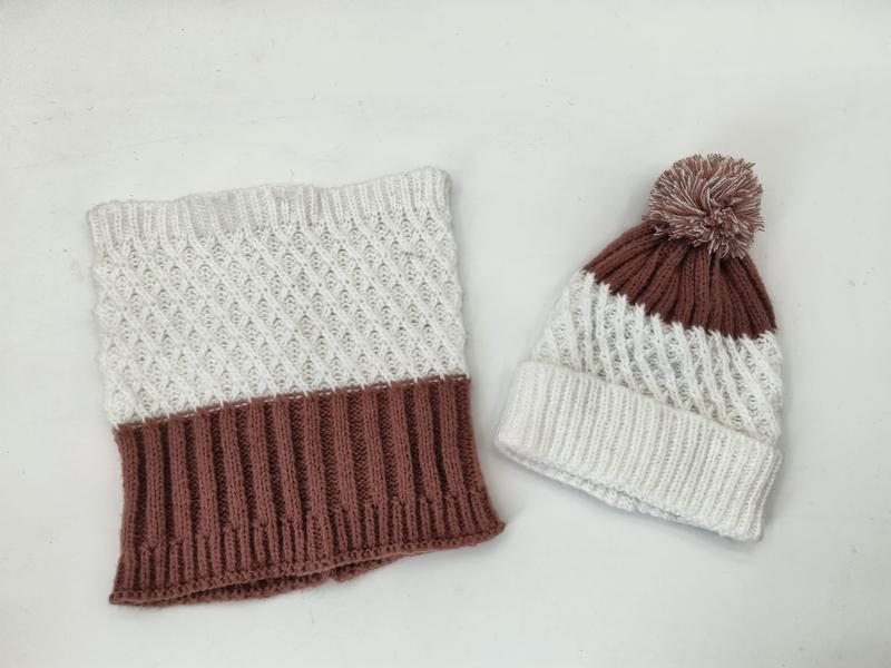 Knitted winter set with cream and mauve cowl neck scarf featuring diamond pattern and matching pom-pom beanie hat on white background - contact for custom design quote