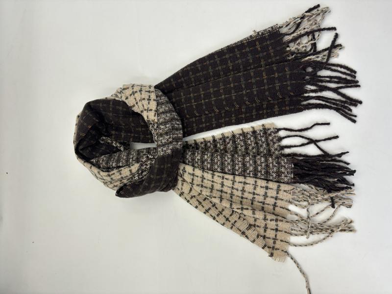 Folded two-tone plaid woven scarf in black and beige with fringe ends, laid flat on white background - factory direct price no middleman