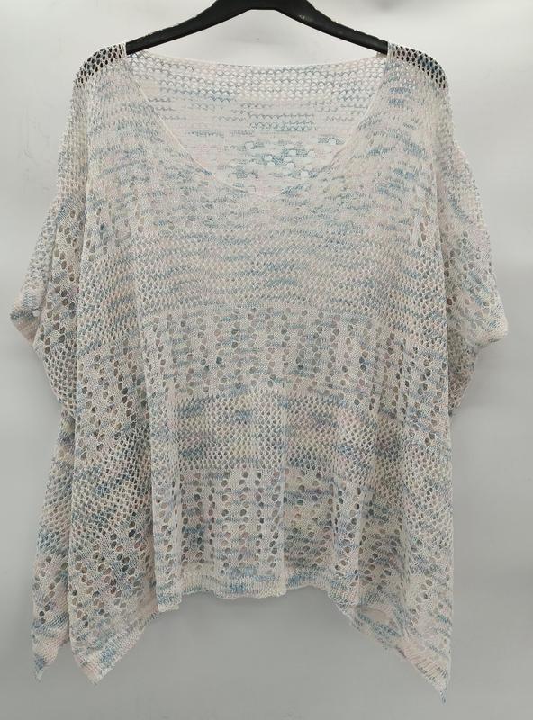 Loose open-knit crochet top in white with blue and pink stripes, batwing sleeves, hanging on black hanger - winter accessories wholesaler