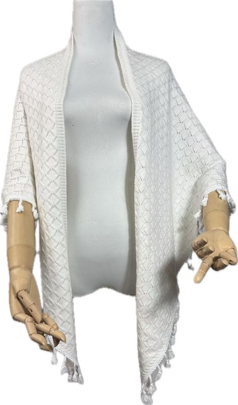 White diamond-pattern knit open-front cardigan wrap with tassel fringe hem and sleeves displayed on mannequin - winter accessories wholesaler