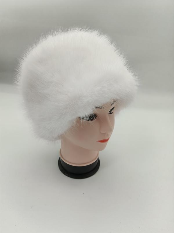 White fluffy faux fur cossack-style winter hat displayed on a mannequin head against a light grey background - ISO 9001 quality controlled
