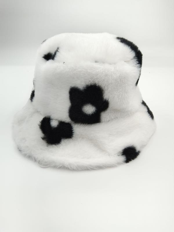 White fuzzy faux fur bucket hat featuring black daisy flower pattern, soft plush texture, displayed on white background - email us get price list now