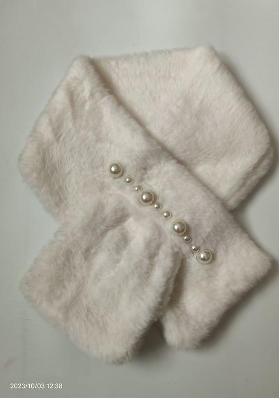White fluffy faux fur crossover neck scarf decorated with graduating pearl beads arranged diagonally across the front - request quote reply same day