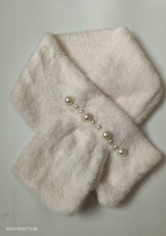 White plush faux fur crossover neck scarf with decorative pearl buttons arranged diagonally on soft fuzzy fabric - ask bulk pricing get discount