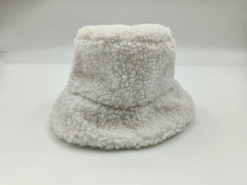 White fluffy sherpa bucket hat with wide brim and teddy fleece texture on white background - custom size no extra charge