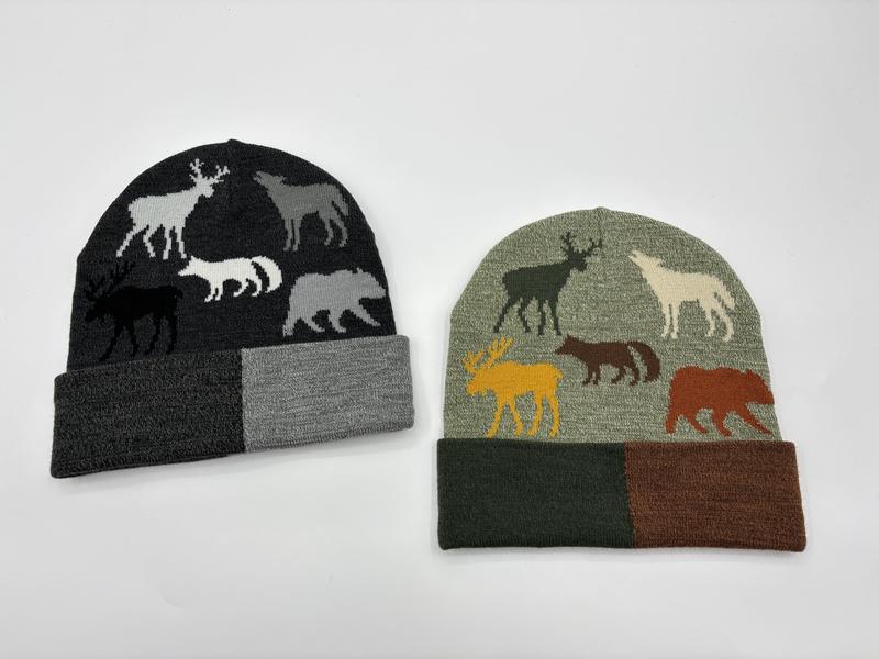 Two knit beanies with jacquard wildlife animal patterns showing deer, moose, wolf, and bear silhouettes in charcoal and sage green colorways - low MOQ 50pcs trial order