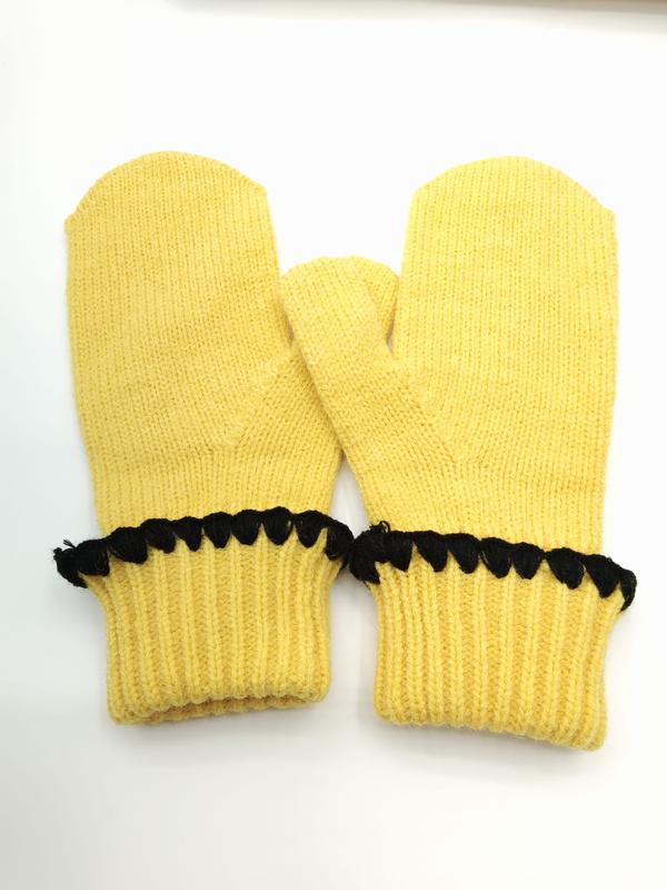 Pair of yellow knitted winter mittens with black scalloped crochet trim along the ribbed cuff, laid flat on white background - wholesale price for USA buyers